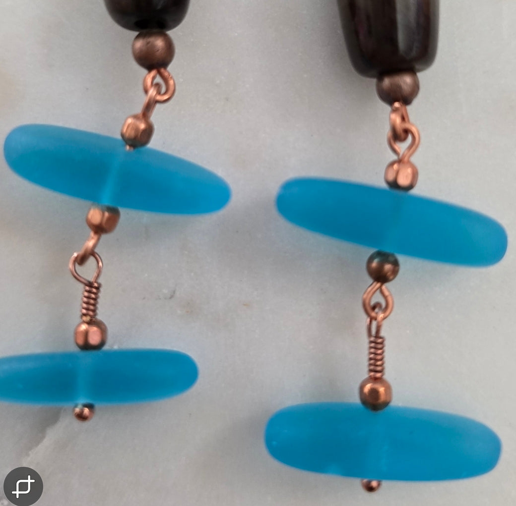 Copper bird blue sand glass earrings.