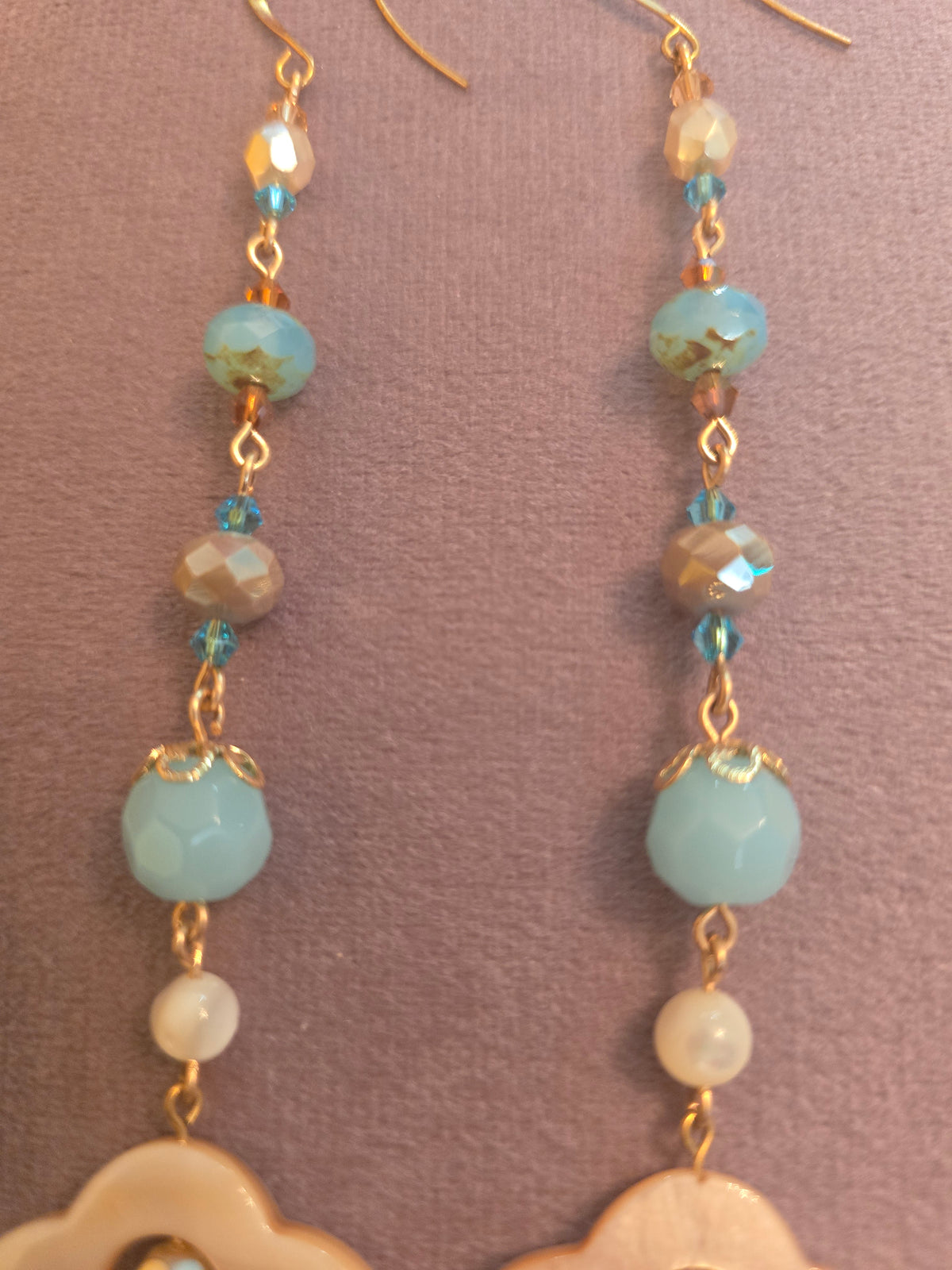 Shoulder tickler shell birdy earrings blue and dark cream