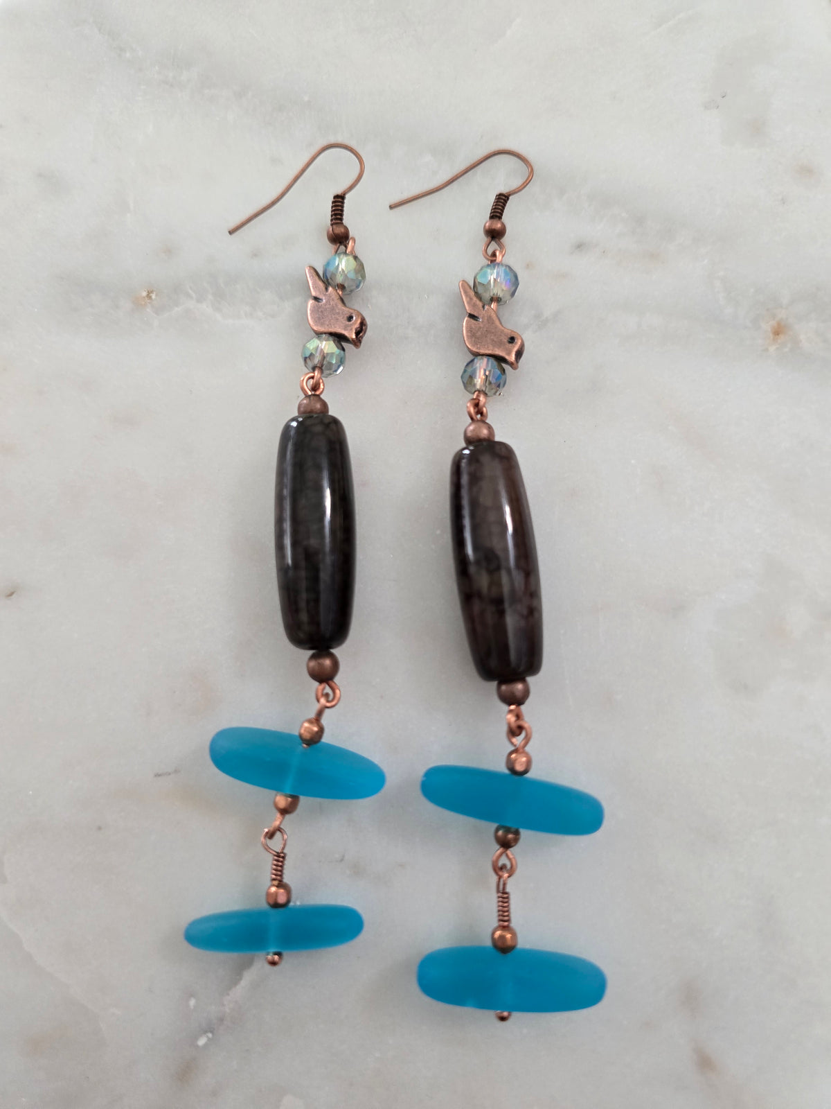 Copper bird blue sand glass earrings.